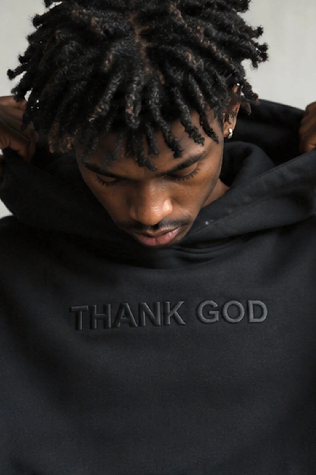 Thank God — embossed black portrait